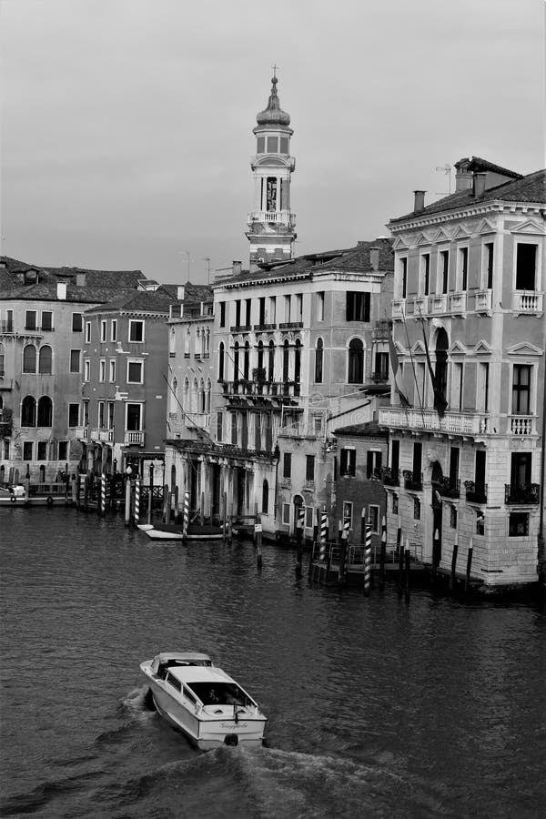 Venice, Italy, December 28, 2018 typical Venice canal with a passing motorboat stock photography