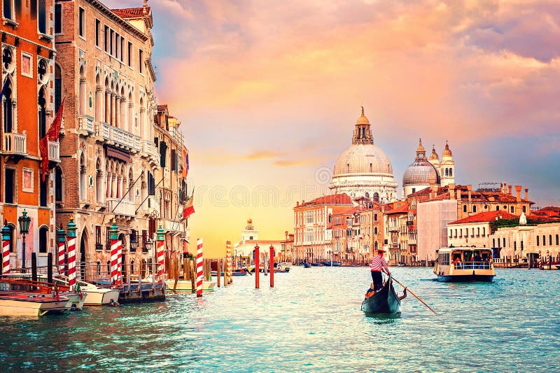 Sunset in Venice, Italy. Boat and gondola on Grand Canal with Basillica Santa Maria della Salute in the background. stock photography Sunset in Venice, Italy. Boat and gondola on Grand Canal with Basillica Santa Maria della Salute in the background. stock photography