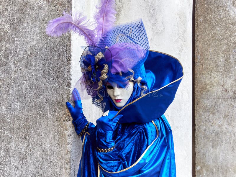 Venice, Italy - March 2, 2019 Person dressed with a typical Venitian Costume during Carnival of Venice