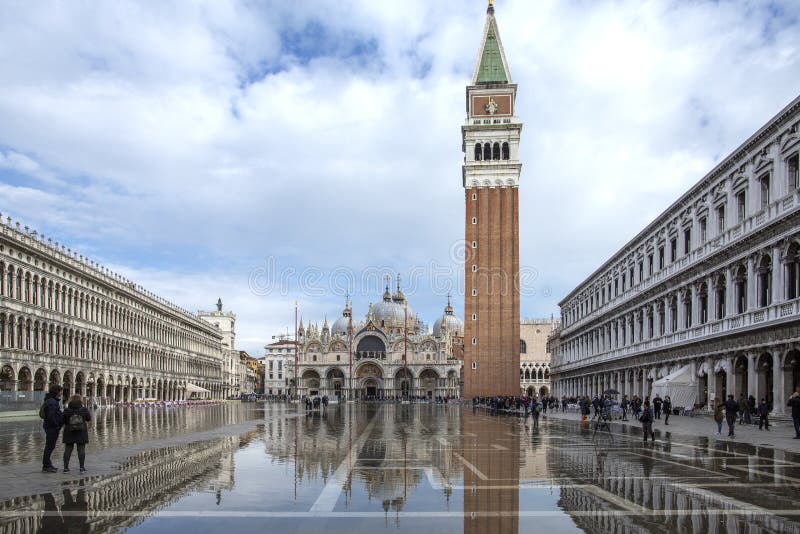 Venice, Italy - November 27, 2018: High water on St. Mark`s Square in Venice. St. Marks Square Piazza San Marco during flood