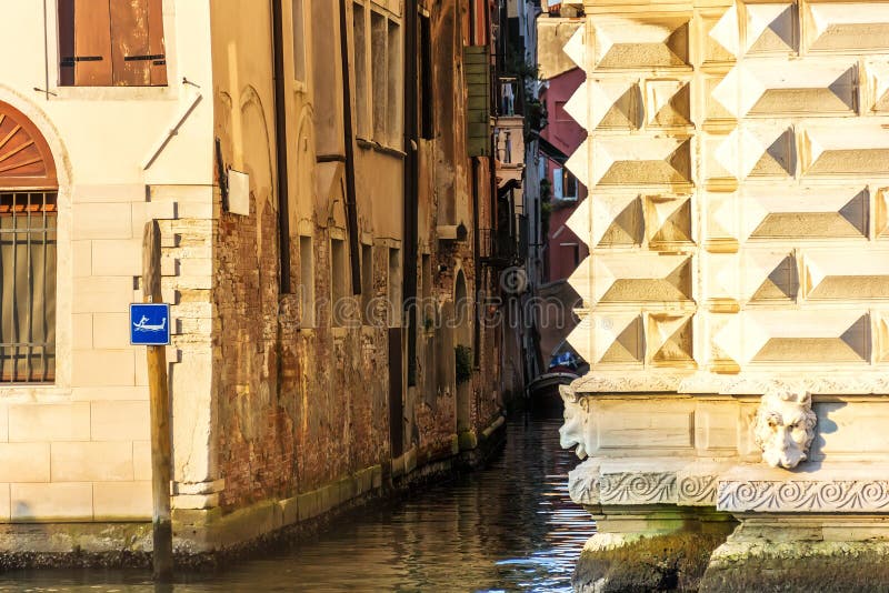 Venice rio, a typical narrow venetian canal between buildings royalty free stock photo Venice rio, a typical narrow venetian canal between buildings royalty free stock photo