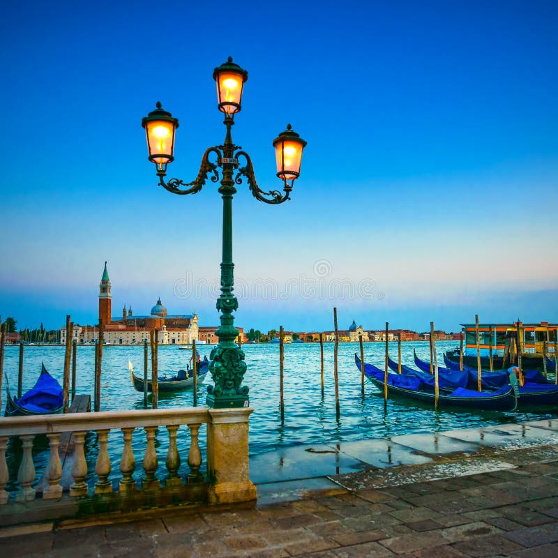 Venice, street lamp and gondolas on sunset. Italy royalty free stock photography Venice, street lamp and gondolas on sunset. Italy royalty free stock photography