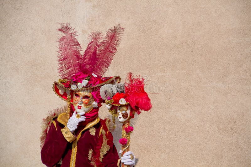 Close up with a pink Venitian carnival character. Close up with a pink Venitian carnival character