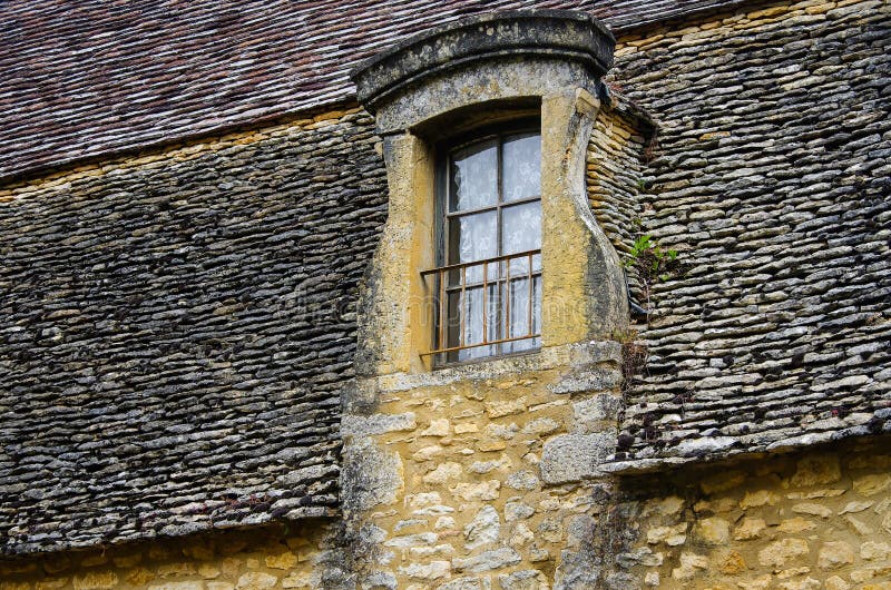 Historic window on a building in Beynac-et-Cazenac, France. High quality photo. Historic window on a building in Beynac-et-Cazenac, France. High quality photo