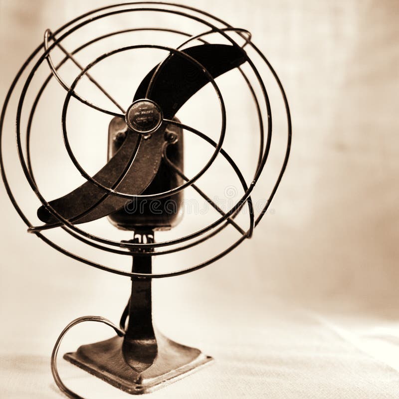 Antique fan in sepia tone, shallow dof, on white background. Antique fan in sepia tone, shallow dof, on white background.