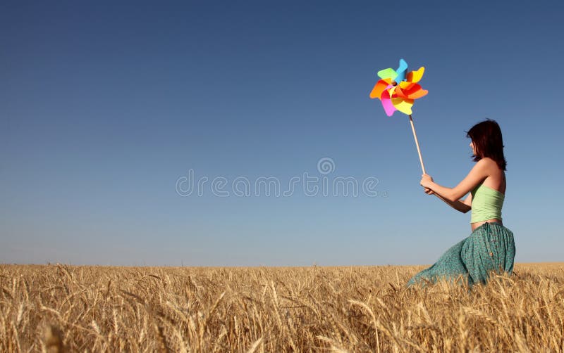 Girl with wind turbine at wheat field 1. Girl with wind turbine at wheat field 1