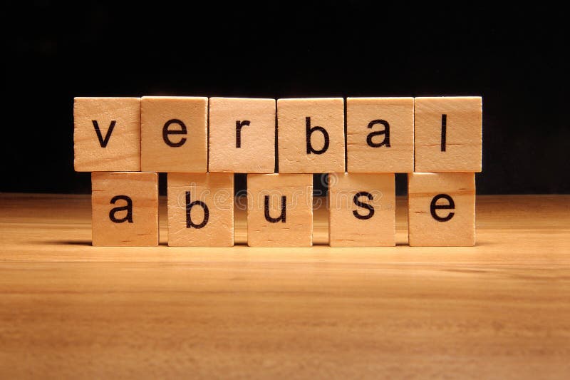 Verbal abuse words written on wood cube