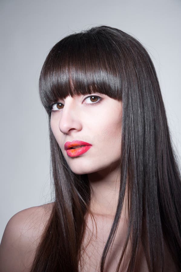 Verbazende vrouw met lang recht donker haar stock afbeelding Verbazende vrouw met lang recht donker haar stock afbeelding