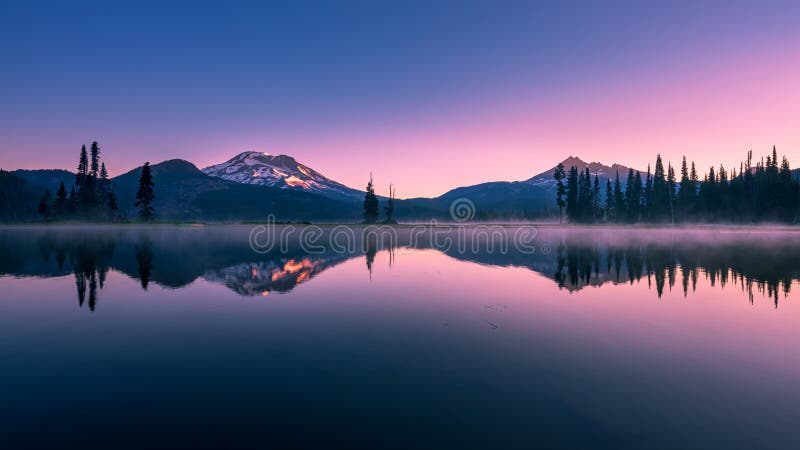 The incredible Sparks Lake with morning views of Sisters and Broken Top near Bend, Oregon. The incredible Sparks Lake with morning views of Sisters and Broken Top near Bend, Oregon