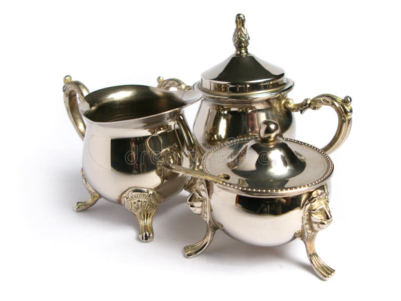 Chromed silver tea set on a white background. Chromed silver tea set on a white background