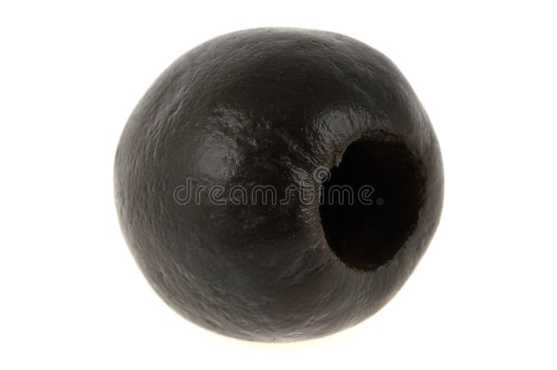 Verde oliva nero bucato in primo piano su fondo bianco fotografia stock Verde oliva nero bucato in primo piano su fondo bianco fotografia stock