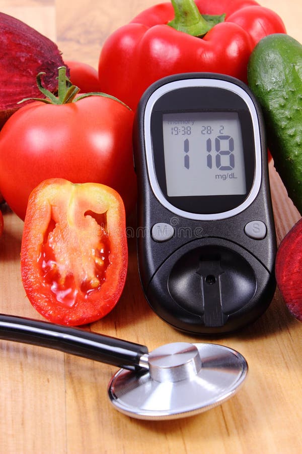 Fresh ripe vegetables, glucose meter and medical stethoscope lying on wooden board, diabetes, healthy lifestyle and nutrition, result of measurement of sugar. Fresh ripe vegetables, glucose meter and medical stethoscope lying on wooden board, diabetes, healthy lifestyle and nutrition, result of measurement of sugar