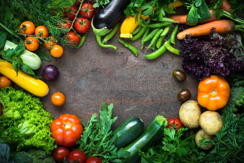 Healthy food background. Frame of raw vegetables at dark stone table. Organic farmer vegetables. Top view. Healthy food background. Frame of raw vegetables at dark stone table. Organic farmer vegetables. Top view.