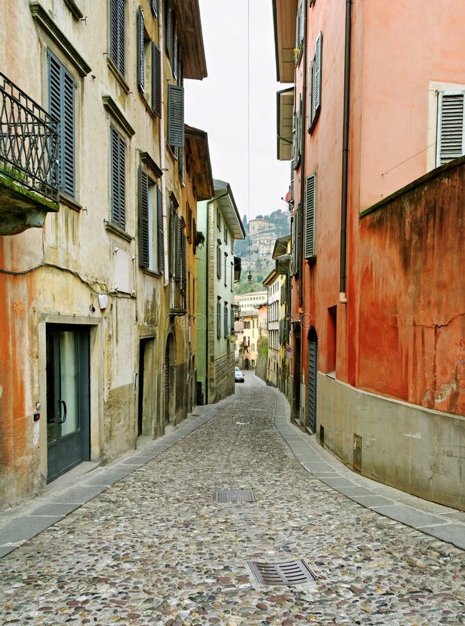 Old narrow street in Bergamo city. Old narrow street in Bergamo city.