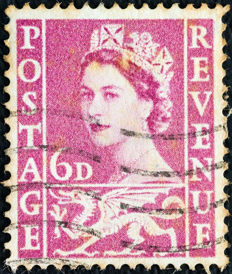 VERENIGD KONINKRIJK - CIRCA 1958: Een in Wales gedrukt stempel toont een portret van het symbool koningin Elizabeth II en Welsh D royalty-vrije stock afbeeldingen VERENIGD KONINKRIJK - CIRCA 1958: Een in Wales gedrukt stempel toont een portret van het symbool koningin Elizabeth II en Welsh D royalty-vrije stock afbeeldingen