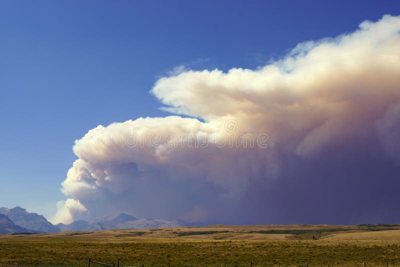 Wildfire is a constant reminder of how nature renews its' self. Here, a smoke plume drifts from a fire in the Rocky Mountain Front out onto the prairie. Wildfire is a constant reminder of how nature renews its' self. Here, a smoke plume drifts from a fire in the Rocky Mountain Front out onto the prairie