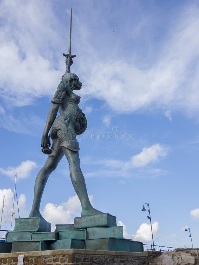 verity-statue-damien-hirst-rising-over-harbour-ilfracombe-devon-england-50222726.jpg