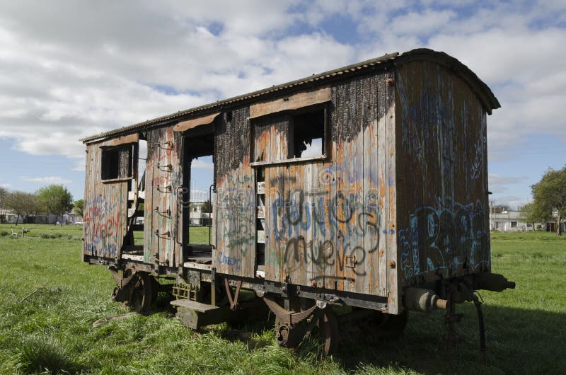 Rauch, Buenos Aires / Argentina; Sept 20, 2014: Abandoned and damaged train wagon at Rauch station, Buenos Aires, Argentina. Rauch, Buenos Aires / Argentina; Sept 20, 2014: Abandoned and damaged train wagon at Rauch station, Buenos Aires, Argentina