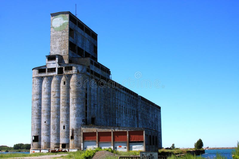 Vintage grain elevator and silos stand near the Buffalo River and Lake Erie waterfront in the city of Buffalo, New York. Vintage grain elevator and silos stand near the Buffalo River and Lake Erie waterfront in the city of Buffalo, New York.