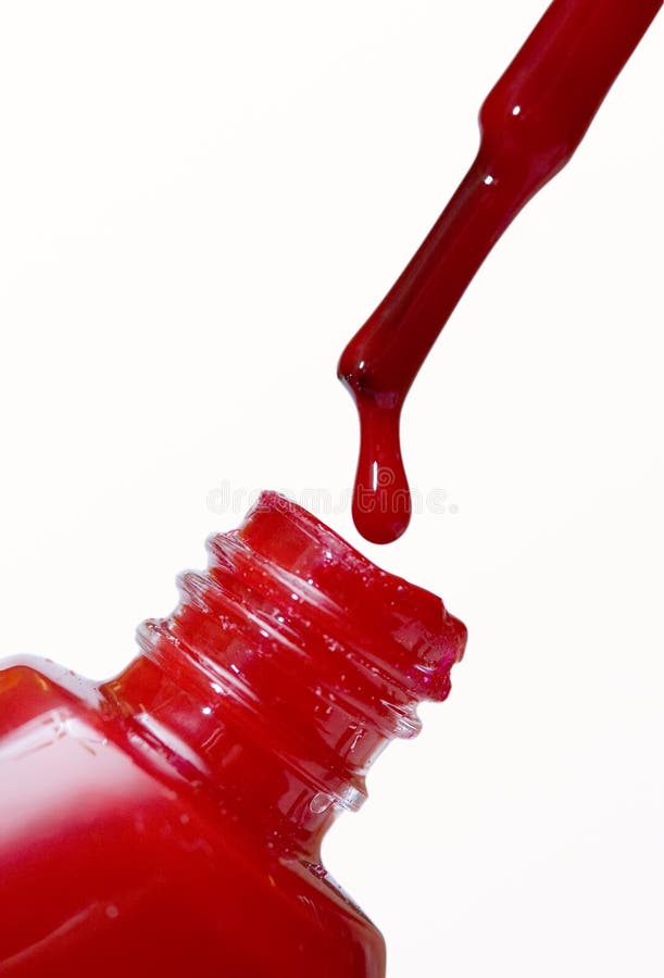 A bottle of red nail polish with brush. A bottle of red nail polish with brush.