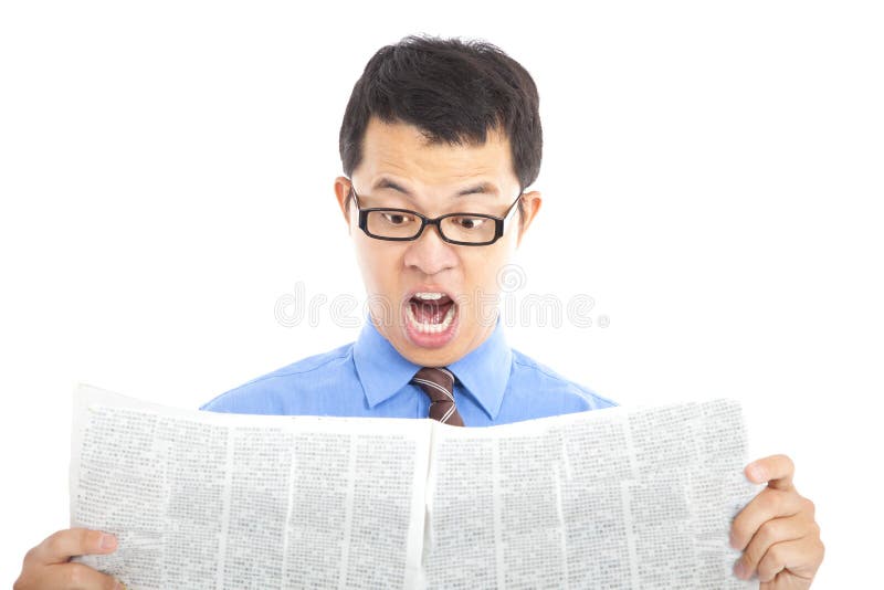 Surprised businessman watching the newspaper. Surprised businessman watching the newspaper