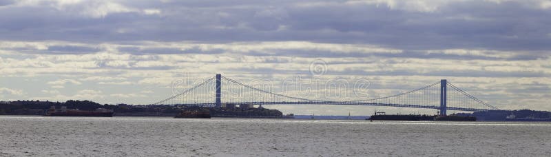 The Verrazano-Narrows Bridge is a double-decked suspension bridge that connects the boroughs of Staten Island and Brooklyn in New York City at the Narrows, the reach connecting the relatively protected upper bay with the larger lower bay. The bridge is named for both the Italian explorer Giovanni da Verrazzano, the first known European navigator to enter New York Harbor and the Hudson River, and for the body of water it spans: the Narrows. It has a center span of 4,260 feet (1,298 m) and was the longest suspension bridge in the world at the time of its completion in 1964, until it was surpassed by the Humber Bridge in the United Kingdom in 1981. It now has the eighth longest center span in the world, and is still the longest bridge span in the Americas.The bridge furnishes a critical link in the local and regional highway system. Since 1976, it has been the starting point of the New York City Marathon. The bridge marks the gateway to New York Harbor; all cruise ships and most container ships arriving at the Port of New York and New Jersey must pass underneath the bridge and thus must be built to accommodate the clearance under the bridge. This is most notable in the case of the ocean liner RMS Queen Mary 2. The Verrazano-Narrows Bridge is a double-decked suspension bridge that connects the boroughs of Staten Island and Brooklyn in New York City at the Narrows, the reach connecting the relatively protected upper bay with the larger lower bay. The bridge is named for both the Italian explorer Giovanni da Verrazzano, the first known European navigator to enter New York Harbor and the Hudson River, and for the body of water it spans: the Narrows. It has a center span of 4,260 feet (1,298 m) and was the longest suspension bridge in the world at the time of its completion in 1964, until it was surpassed by the Humber Bridge in the United Kingdom in 1981. It now has the eighth longest center span in the world, and is still the longest bridge span in the Americas.The bridge furnishes a critical link in the local and regional highway system. Since 1976, it has been the starting point of the New York City Marathon. The bridge marks the gateway to New York Harbor; all cruise ships and most container ships arriving at the Port of New York and New Jersey must pass underneath the bridge and thus must be built to accommodate the clearance under the bridge. This is most notable in the case of the ocean liner RMS Queen Mary 2.