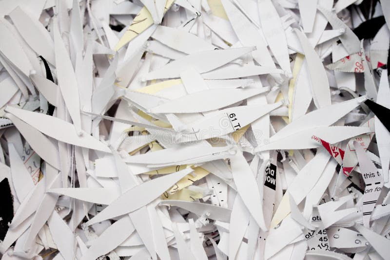 Closeup of pieces of shredded paper protecting personal privacy. Closeup of pieces of shredded paper protecting personal privacy