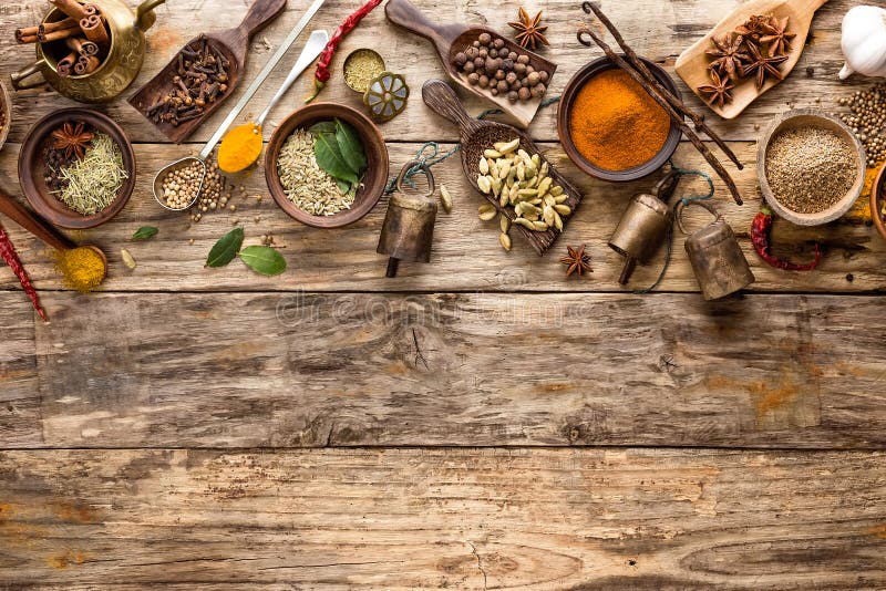 Various spices in a bowls on wooden table. Various spices in a bowls on wooden table