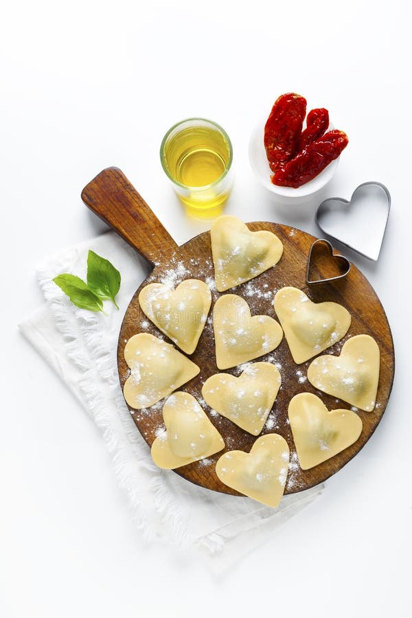 Fresh Italian ravioli in shape of heart. food background. on white. Fresh Italian ravioli in shape of heart. food background. on white