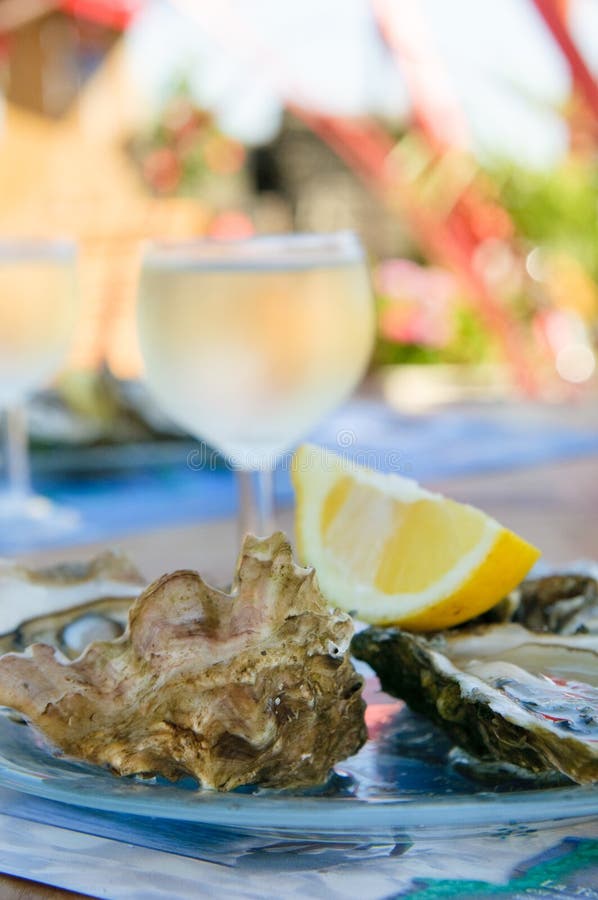 Fresh oysters and a glass of white wine. Fresh oysters and a glass of white wine