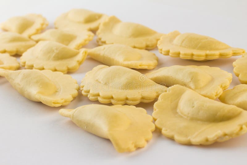 Italian Fresh Ravioli Pasta on white background. Half Moon Shape. Italian Fresh Ravioli Pasta on white background. Half Moon Shape