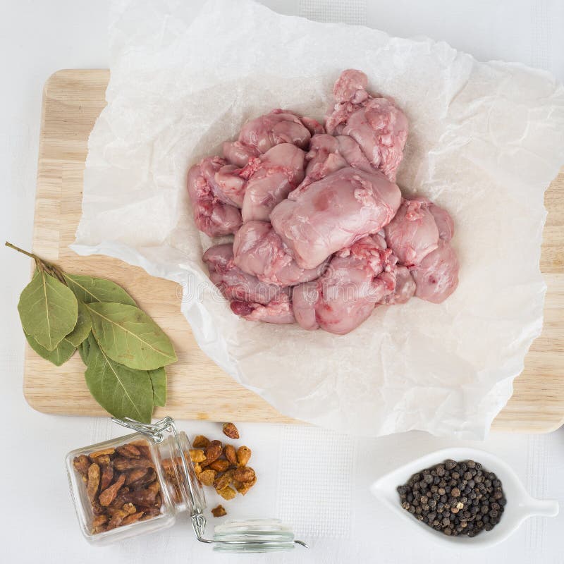 Fresh lamb sweetbreads and some ingredients to cook them. Fresh lamb sweetbreads and some ingredients to cook them