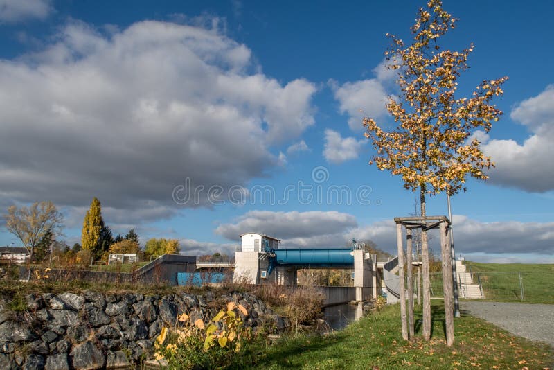 Weir - Low dam in Bayreuth Germany, Bavaria, Upper Franconia built across a river to raise the level of water upstream or regulate its flow. Weir - Low dam in Bayreuth Germany, Bavaria, Upper Franconia built across a river to raise the level of water upstream or regulate its flow.