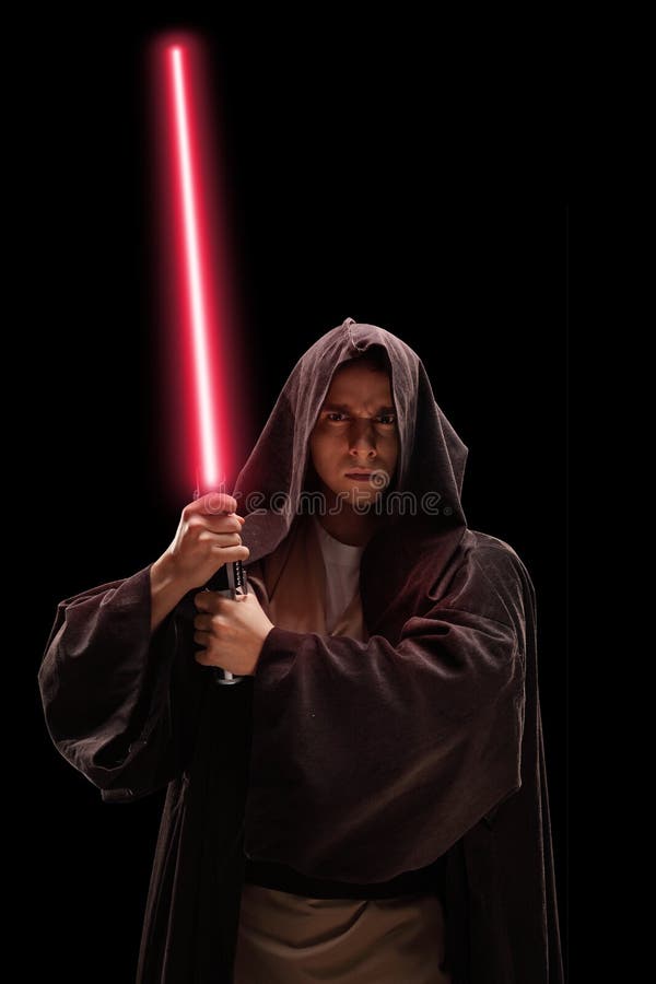 Verticaal van een strijder met laserzwaard dat wordt geschoten stock foto's Verticaal van een strijder met laserzwaard dat wordt geschoten stock foto's
