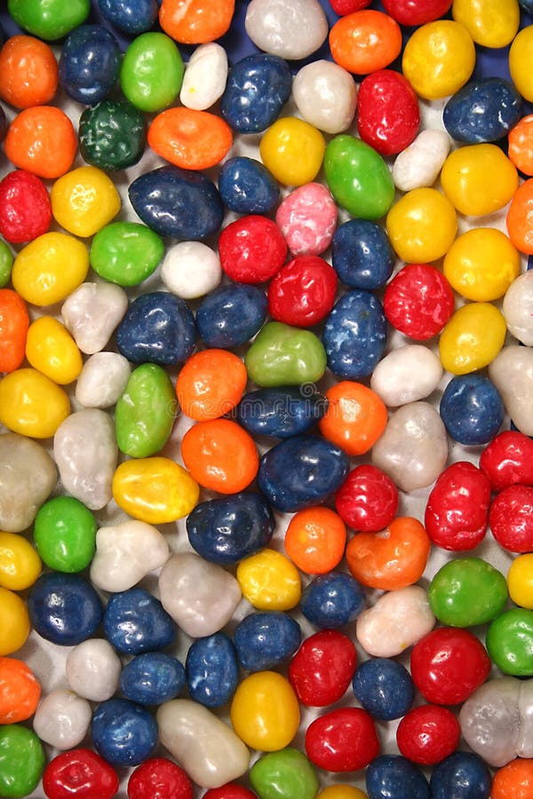 Vertical background made of multi-coloured sweets with raisin 1