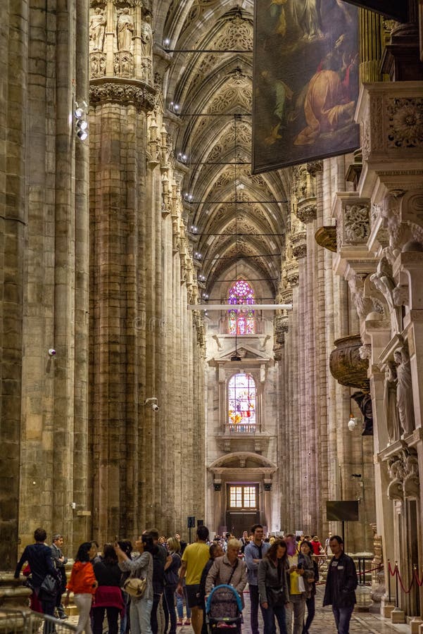 Vertical of Center Nave columns and tile floor inside interior Duomo di Milano