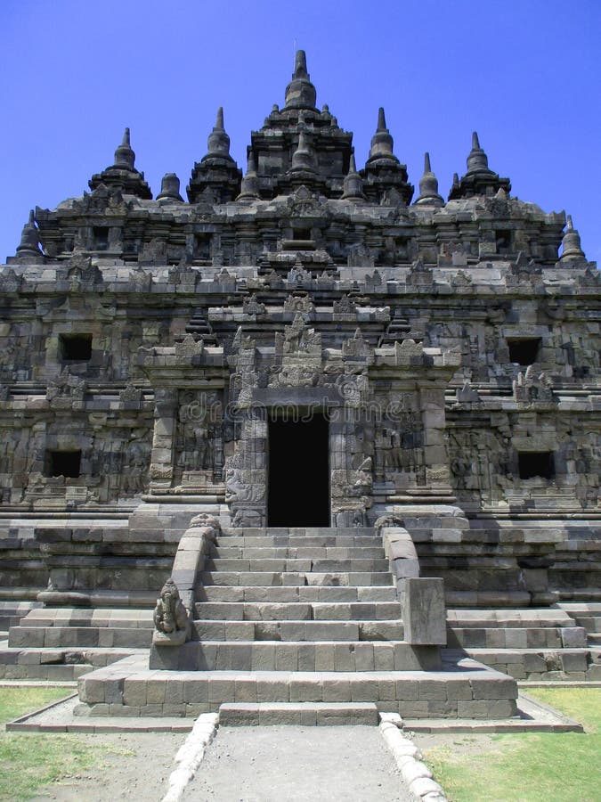 Vertical Close up Portrait of Beautiful Plaosan Temple Candi, Klaten, Central Java, Indonesia stone rocks stairs scenery blue sky. Historical landmark, temple royalty free stock images Vertical Close up Portrait of Beautiful Plaosan Temple Candi, Klaten, Central Java, Indonesia stone rocks stairs scenery blue sky. Historical landmark, temple royalty free stock images