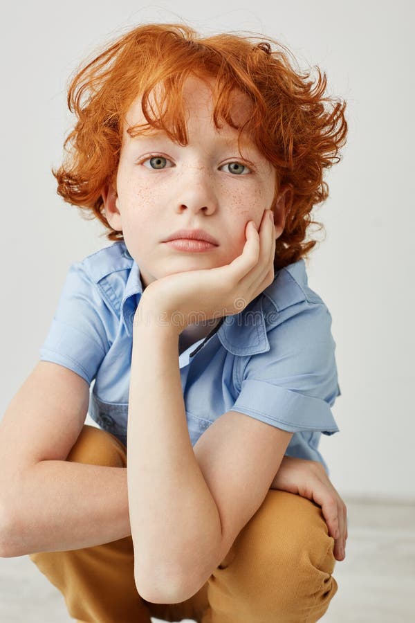 Vertical Close Up Shot of Funny Boy with Orange Hair and Freckles, Holding Head with Hand, Looking in Camera with Calm Stock Photo - Image of joyful, adolescent: 103250014 Vertical Close Up Shot of Funny Boy with Orange Hair and Freckles, Holding Head with Hand, Looking in Camera with Calm Stock Photo - Image of joyful, adolescent: 103250014