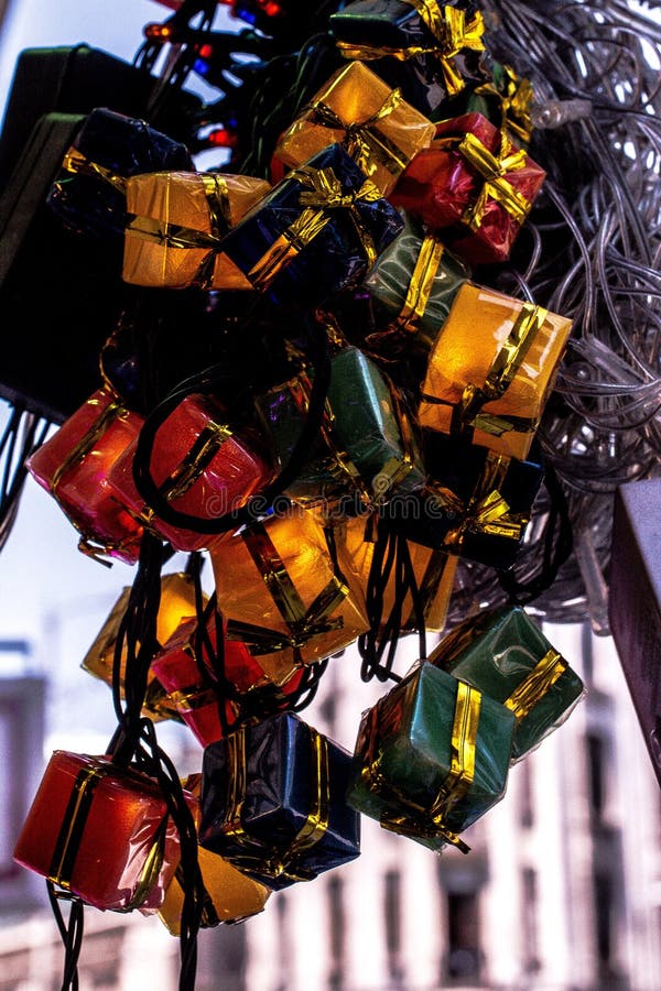 Vertical Closeup of Christmas Tree Lights Shaped Like Presents Stock