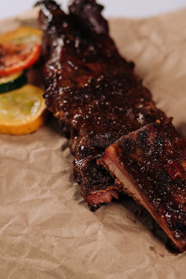 Vertical Closeup of Cooked Ribs on a Butcher Paper Stock Photo Image of slices, cooking 258618954