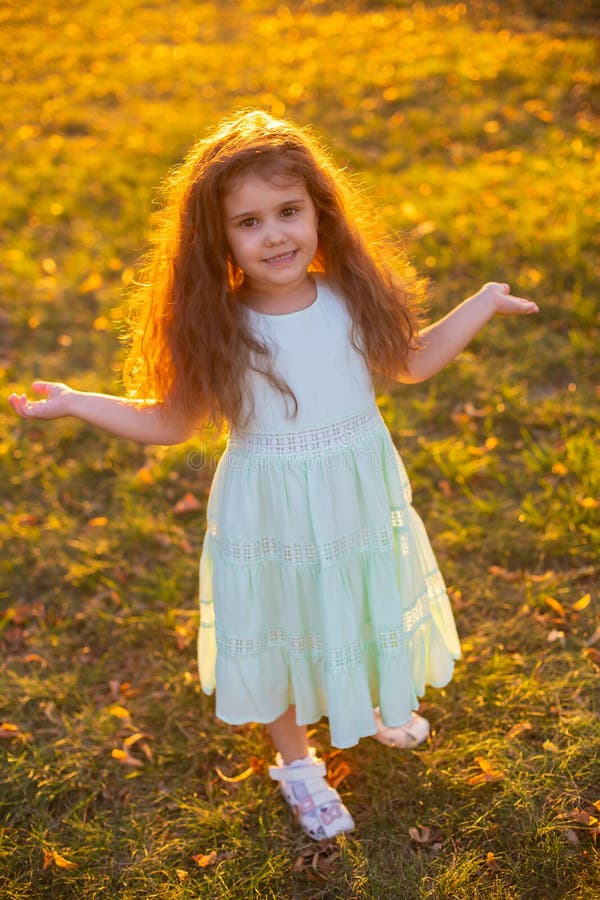 Vertical Closeup Portrait at Sunset of a Little Funny Girl with Long Curly Hair Stock Photo - Image of children, cute: 177218556 Vertical Closeup Portrait at Sunset of a Little Funny Girl with Long Curly Hair Stock Photo - Image of children, cute: 177218556