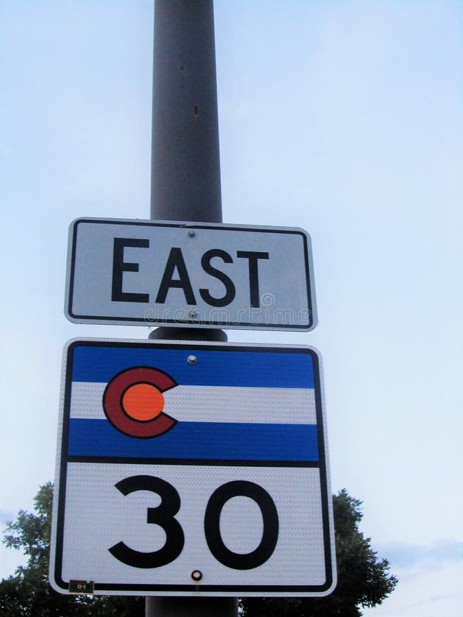 Vertical closeup shot of East road sign with 30 speed limit stock images Vertical closeup shot of East road sign with 30 speed limit stock images