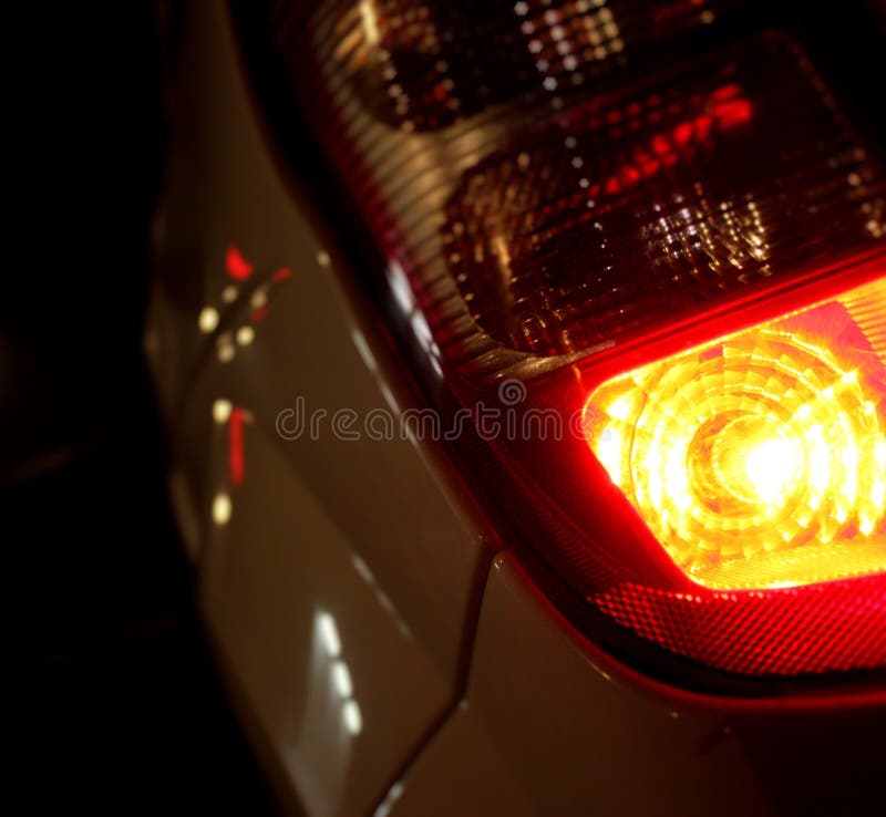 Vertical Closeup Shot of the Tail Lights of a White Car Stock Image