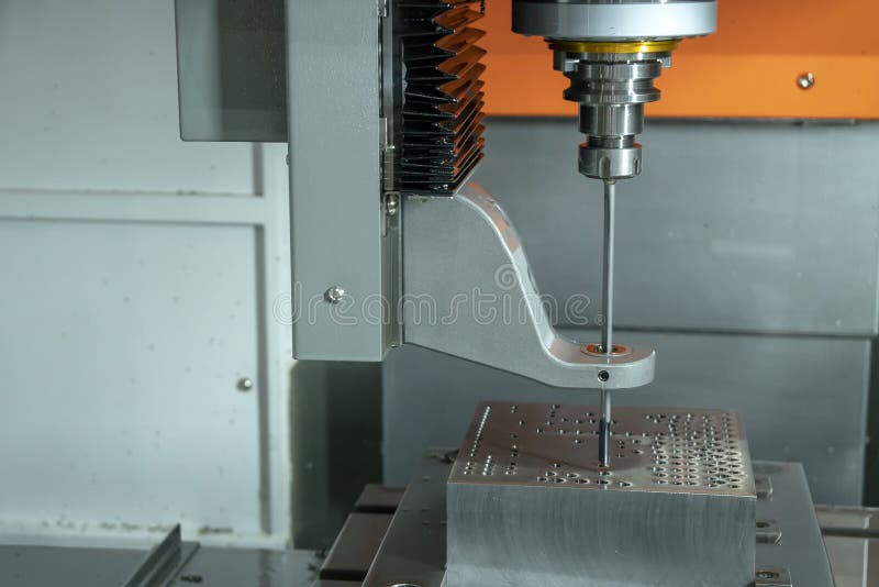 The vertical CNC gun-drill machine drilling the mold royalty free stock photography