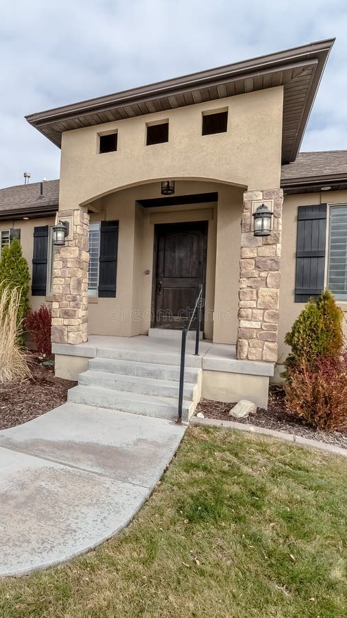 Vertical Curving front path to a front door of a house