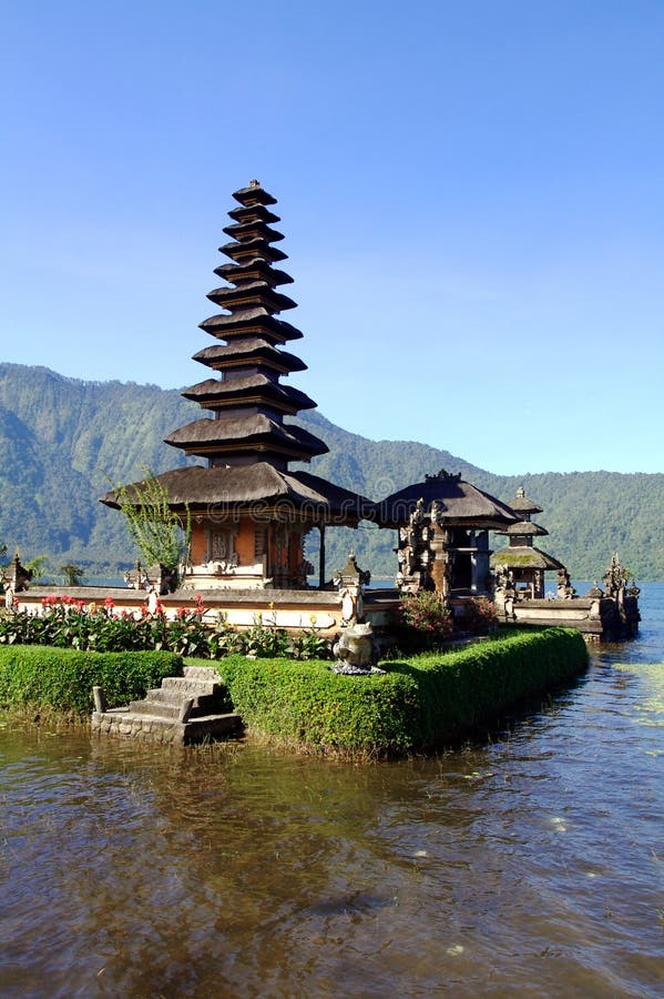 Vertical view of picturesque temple on lake in extinct volcano crater. Vertical view of picturesque temple on lake in extinct volcano crater