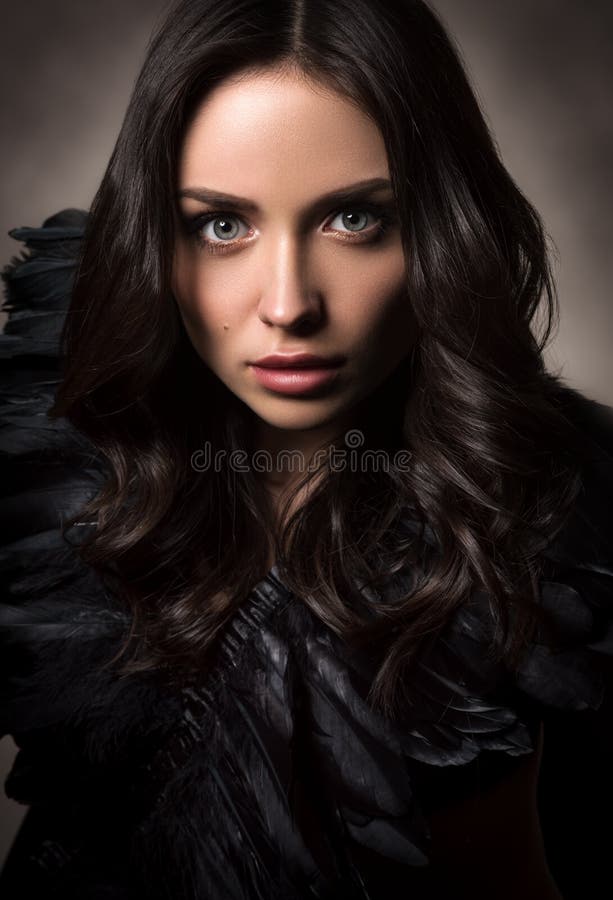 Vertical fashion portrait in dark tones. Beautiful young woman in black royalty free stock images Vertical fashion portrait in dark tones. Beautiful young woman in black royalty free stock images