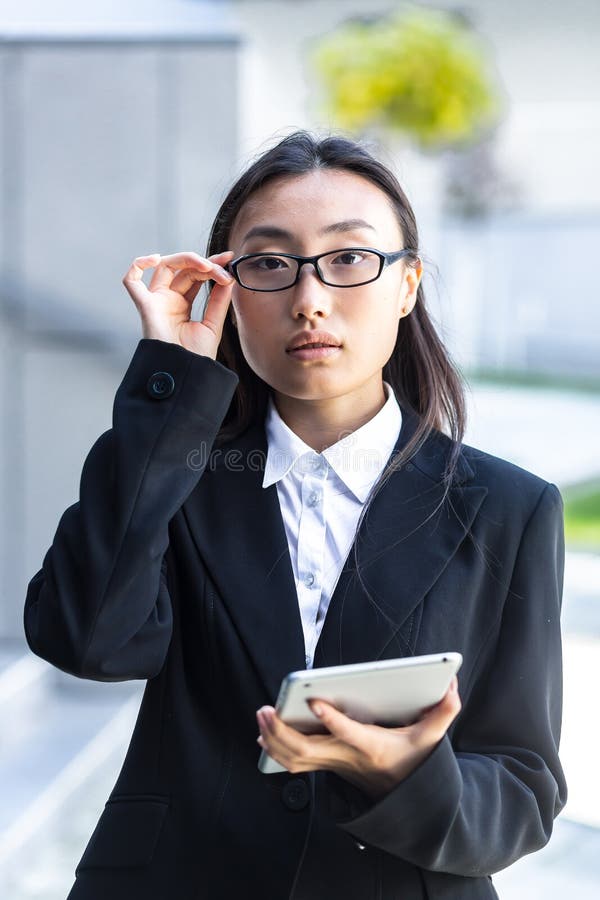 Vertical Frame, Portrait of Asian Female Teacher with Glasses Looking