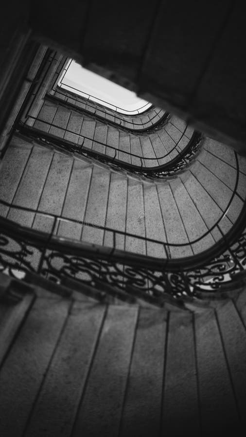 Vertical grayscale picture of a repetitive stairs stock image