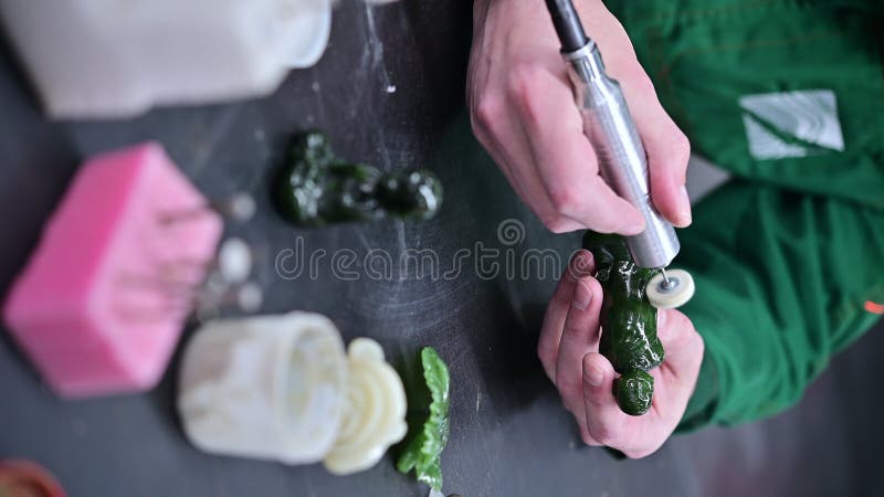Vertical greenstone jewellery process making stock footage
